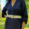 Photo of monochromatic  hand-embroidered floral wool belt by Jenny Krauss, made in Peru with lead-free metal buckle. Versatile design with five sets of 2" spaced holes for hip or waist wear, featuring slight stretch for comfort.