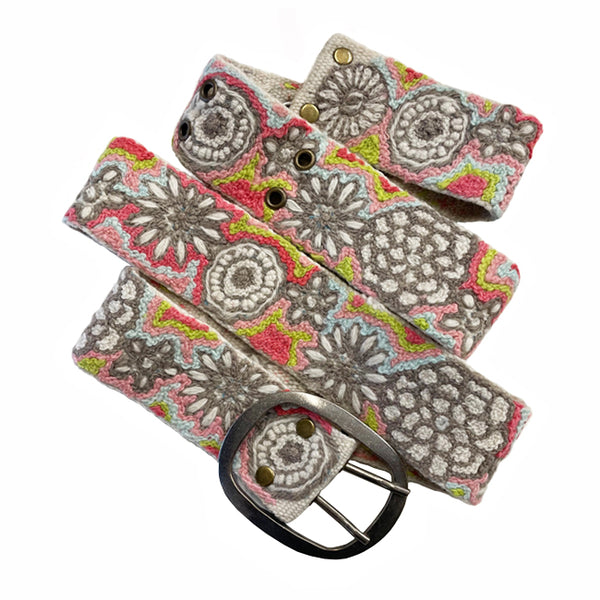 Photo of colorful hand-embroidered floral wool belt by Jenny Krauss, made in Peru with lead-free metal buckle. Versatile design with five sets of 2" spaced holes for hip or waist wear, featuring slight stretch for comfort.