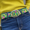  Photo of colorful hand-embroidered floral wool belt by Jenny Krauss, made in Peru with lead-free metal buckle. Versatile design with five sets of 2" spaced holes for hip or waist wear, featuring slight stretch for comfort.