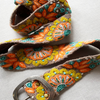 Photo of colorful hand-embroidered floral wool belt by Jenny Krauss, made in Peru with lead-free metal buckle. Versatile design with five sets of 2" spaced holes for hip or waist wear, featuring slight stretch for comfort.