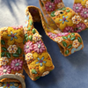 Colorful embroidered fabric with floral patterns on a blue background