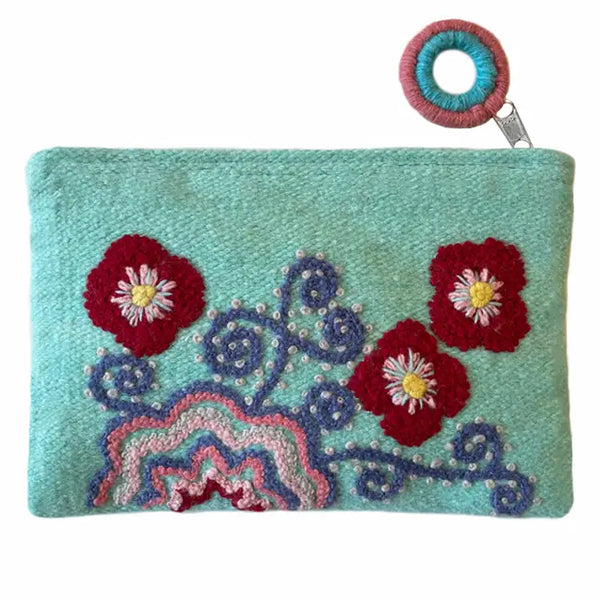  Photo of Jenny Krauss embroidered wool pouch, multi-functional travel accessory. Handcrafted with 100% wool, cotton lining, and sturdy metal zipper. Versatile for use as a wallet, clutch, or keepsake bag. Measures 5.5" L x 8" W. Designed in the U.S.A. and handmade in Peru by skilled artisans.