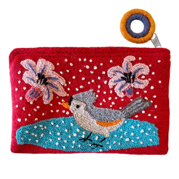 Photo of Jenny Krauss embroidered wool pouch, multi-functional travel accessory. Handcrafted with 100% wool, cotton lining, and sturdy metal zipper. Versatile for use as a wallet, clutch, or keepsake bag. Measures 5.5" L x 8" W. Designed in the U.S.A. and handmade in Peru by skilled artisans.